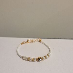 Elegant Gold and White Beaded Bracelet
